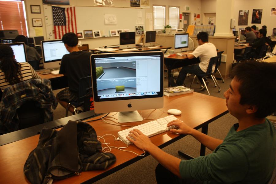 Digital design students work on creating a new app
