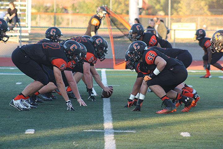 The Cal High Football Team Warms Up for Their Game Against Granada