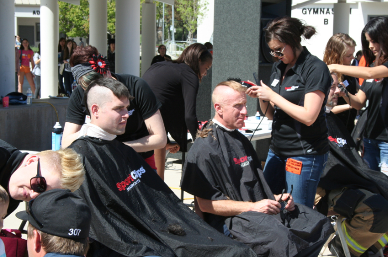 Volunteers shave it off for cancer