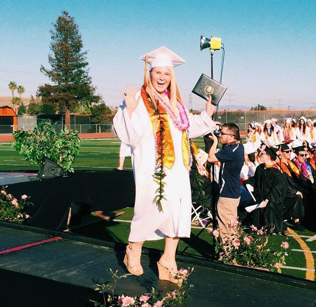 Class of 2015 graduate Erin Fox wore Cal’s traditional white gown for females last June. All students will wear black gowns at the Cal’s future graduation ceremonies.