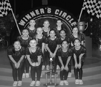 The California Grizzly song team poses in the Winner’s Circle after performing a routine at Nationals at Disney World.