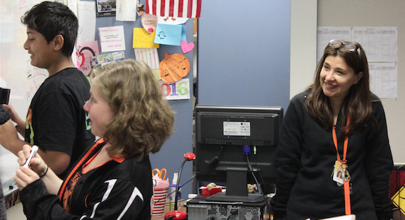 French teacher Madame Colard helps freshmen students Rhys Cramer and Ish Kaatar learn common French slang terms in class to immerse students in French Culture.