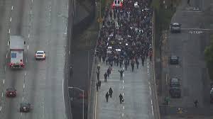 In Oakland, protesters block major highways to take a stance in support of the Black Lives Matter Movement.