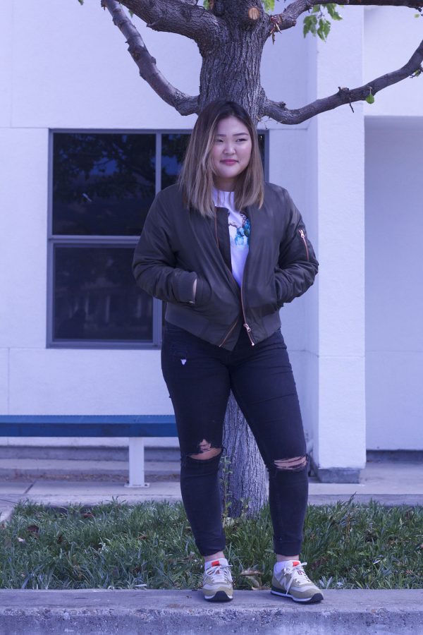 Junior Iris Kang modeling off her stylish bomber jacket.