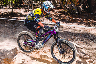 Kayla Neumann races down a mountain bike trail in Mammoth Lakes over the summer.