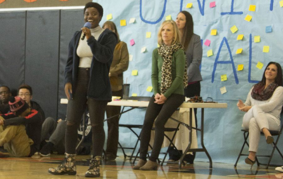 Freshman Lajolie Beurge addresses the student body with her poetry at the assembly. 
