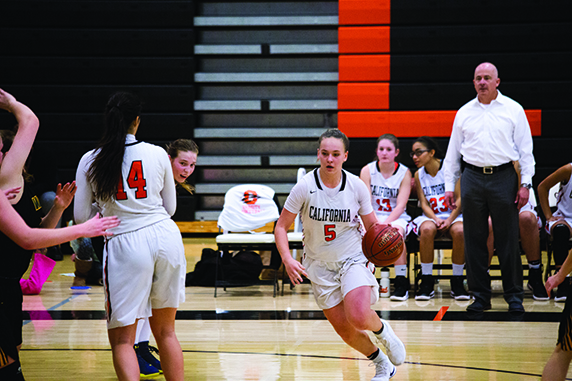  At right Mouton drives to the basket during Cal’s  60-54 win over San Ramon Valley last month. Moulton led the team with 16 points in the victory.