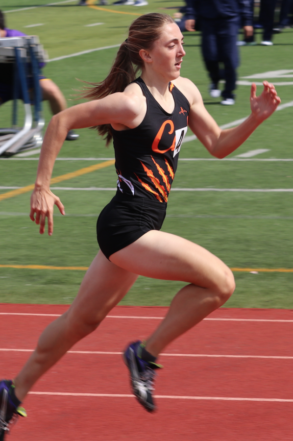 Junior Alyssa Brewer streaks to the finish line in a track meet at Cal High.