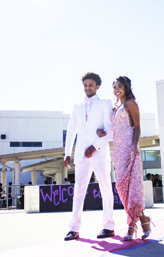 Seniors Jewelian Johnson, left, and Sydney Quilalang modeled what to wear for formal dances, such as the upcoming Senior Ball.