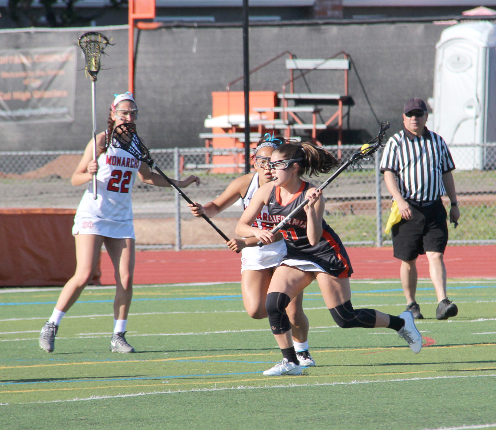 Senior captain Ashley Ward, right, gears up for a shot in Cal’s monumental win over powerhouse Mater Dei on April 20.