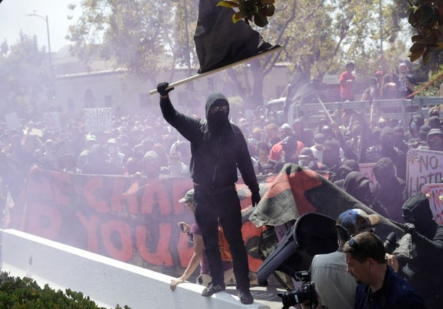 A protester from the alt-left organization ANTIFA stirs up the crowd in Berkeley on Aug. 27. Thousands of pretesters came together in Berkeley and San Francisco to day before in response to planned speeches from conservative groups Patriot Prayer and No Marxism.