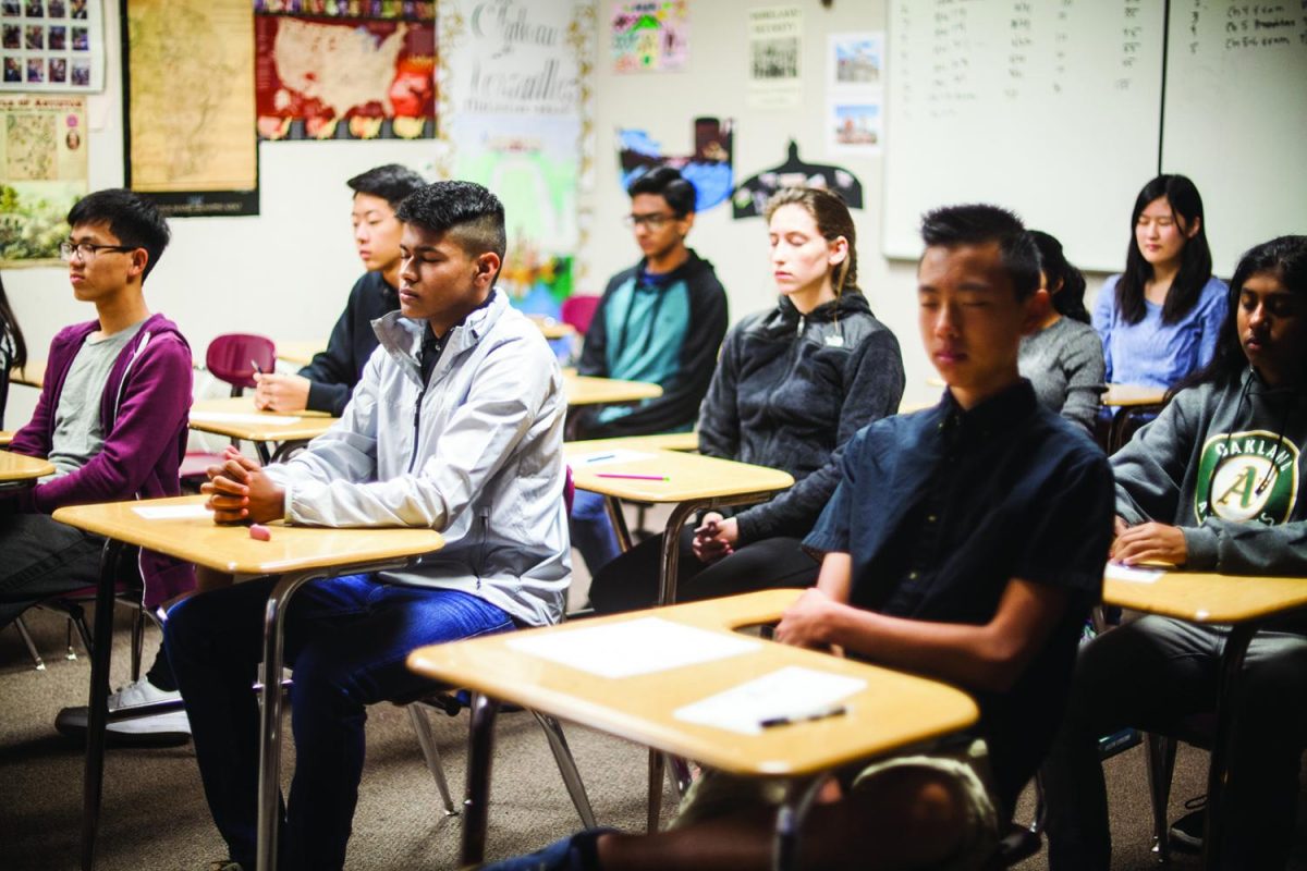 Students in Hodges’ AP US History class meditate at their desks before taking a test.