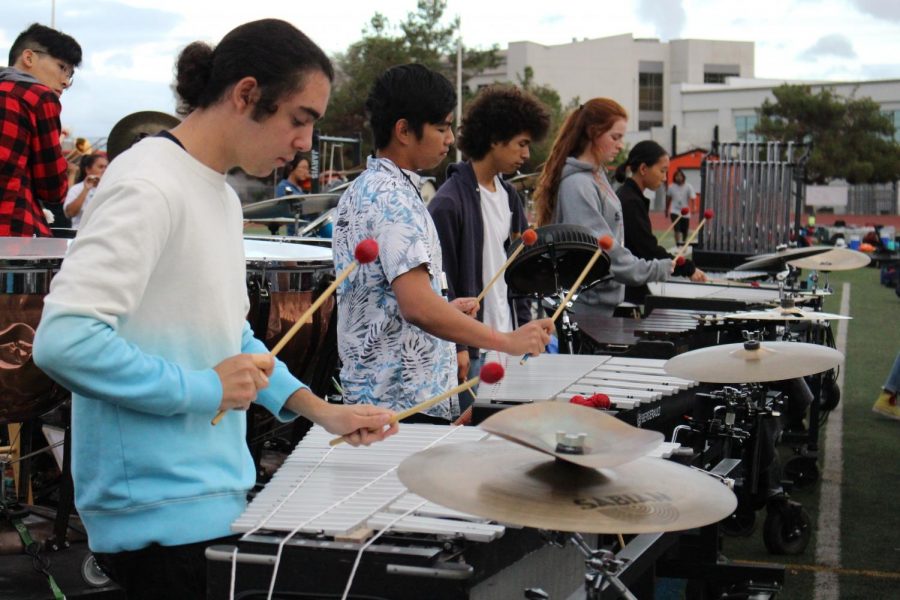 From+left+to+right%2C+percussion+players+John+Ty%2C+Ahmad+Aboutaam%2C+Brandon+Victoriano%2C+Caleb+Giles%2C+Delaney+Lockhart%2C+and+Huey+Chan+are+hard+at+work+during+practice.