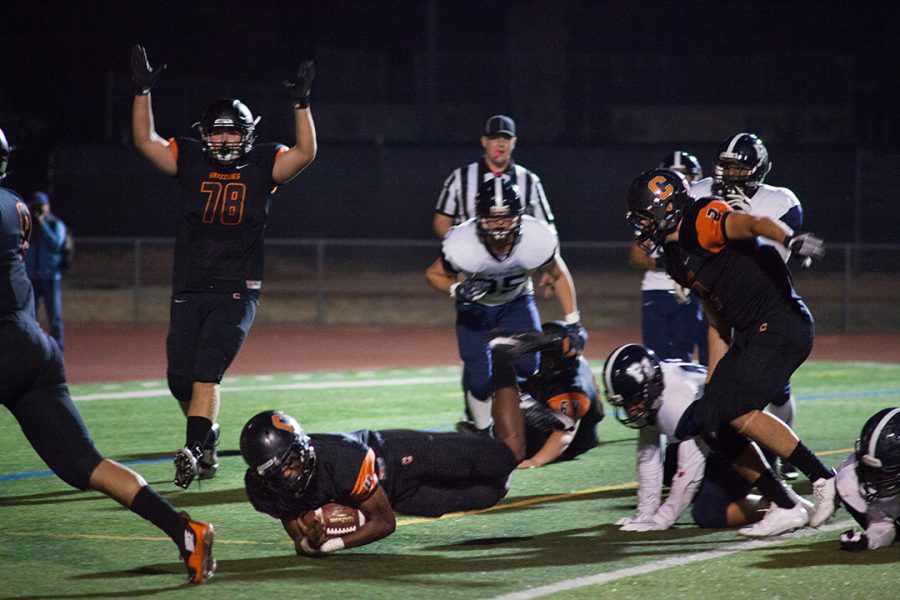 Senior Savage Hugh dives into the end zone for a touch down against Dougherty Valley. 