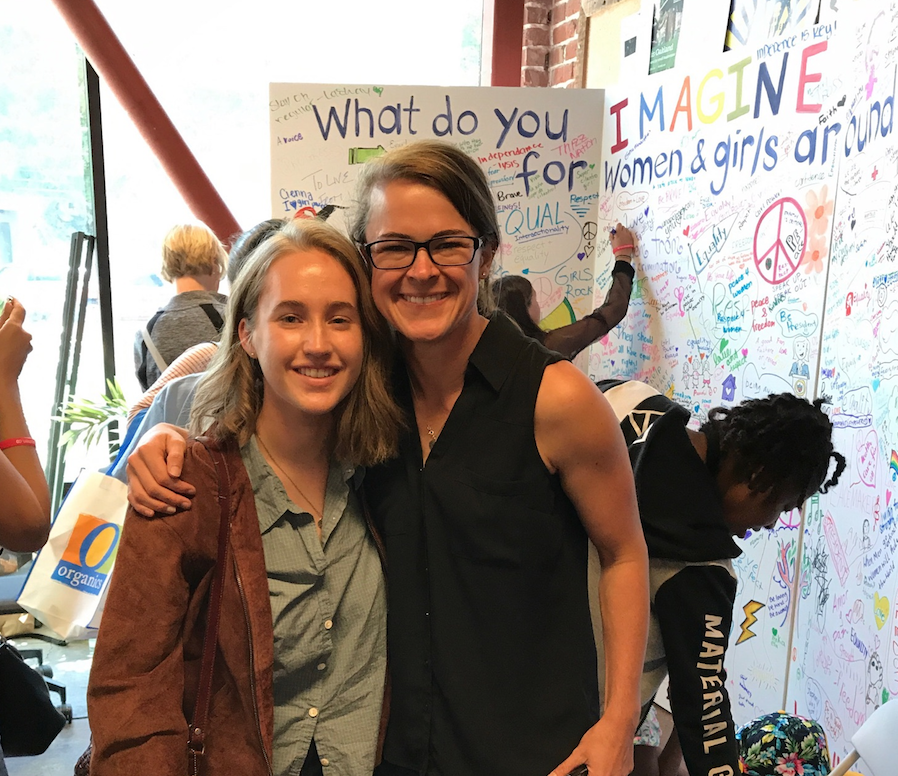 Senior Katie Kravitz running a booth at the Girls Festival as a part of her iQuest internship. 