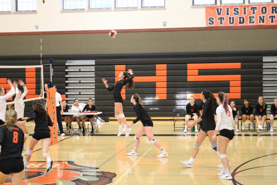 Junior Julianna Bronzini attacks the ball from the right side. 