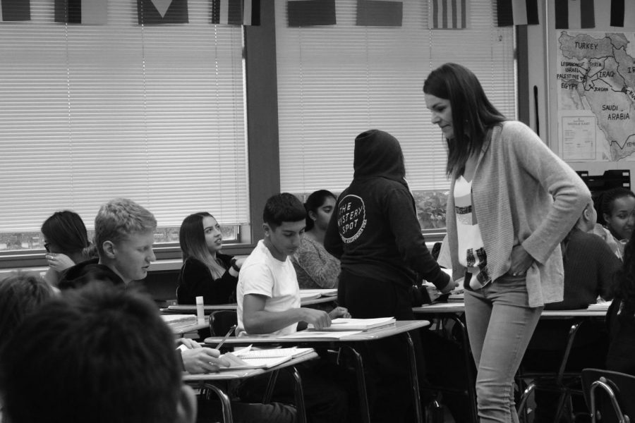 American history teacherAnja Wheeler checks in with students while they do work in class. Wheeler is one of four Cal High teachers that has started teaching their history classes thematically, rather than in the traditional chronological order.