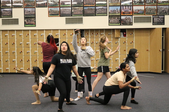 Winter Guard rehearses a symbolic scene for their performances where a Chinese immigrant on Angel Island wakes up from her nightmare.