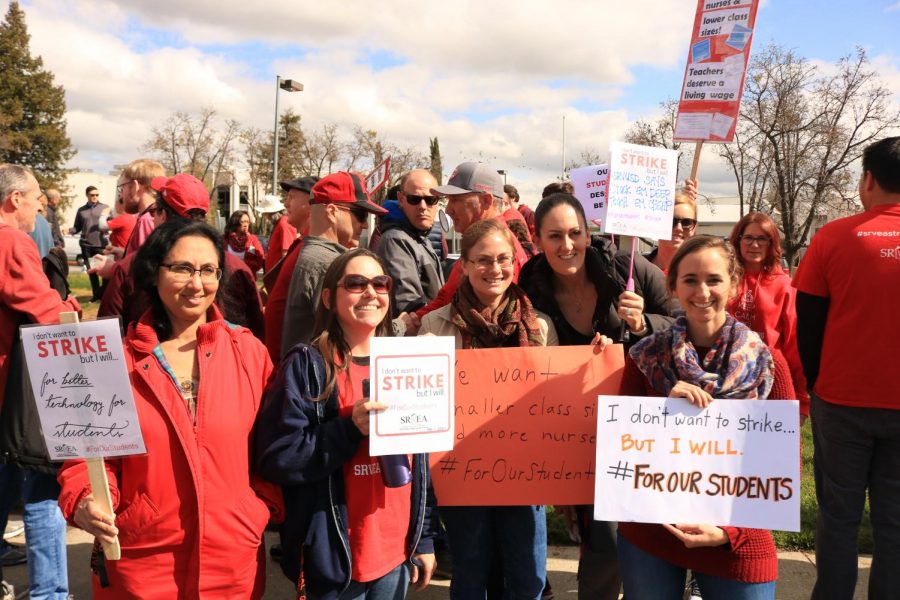 Cal High teachers hold up signs at the teacher walkout on February 28th. The teachers’ union and the district have since then settled negotiations. 
