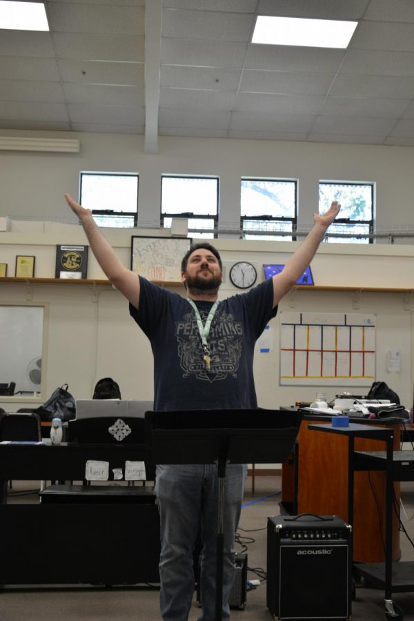 Choir teacher Nicholas Patton raises his hands and rouses his class to attention. Patton has directed Cal High’s concert, treble and chamber choirs for the past five years, but he is leaving the school this week due to personal reasons.