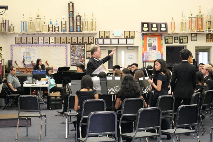 Above, Cal Band director Kent Johnson instructs wind ensemble before their sight reading session.  Below, an alto sax soloist from Pittsburg High’s freshman Jazz Band performs. Schools throughout Northern California attended the festival.