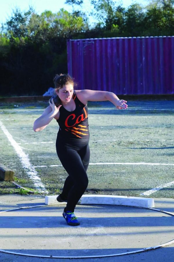 Annika Lister prepares to throw the shot put in a meet against Monte Vista. She would end up with the best shot put distance of anyone in the meet with a throw of 30 feet, 2 inches.