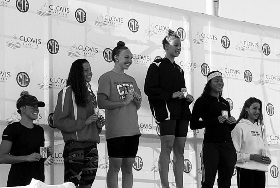 Senior swimmer Daniella Hawkins, second from the left,  poses with her second place medal in the 500 freestyle at the CIF State Championships on May 18 at Clovis West High School. She also placed ninth in the 200 free.