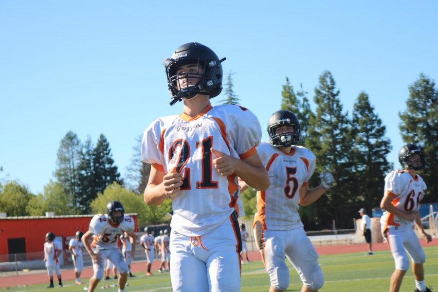 Sophomore Jackson Slavens (21) practices with his freshman teammates on the JV team.