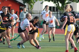 Players fight for control of the ball in last year’s powderpuff game. Little did they know that this would Cal’s final time hosting the event.