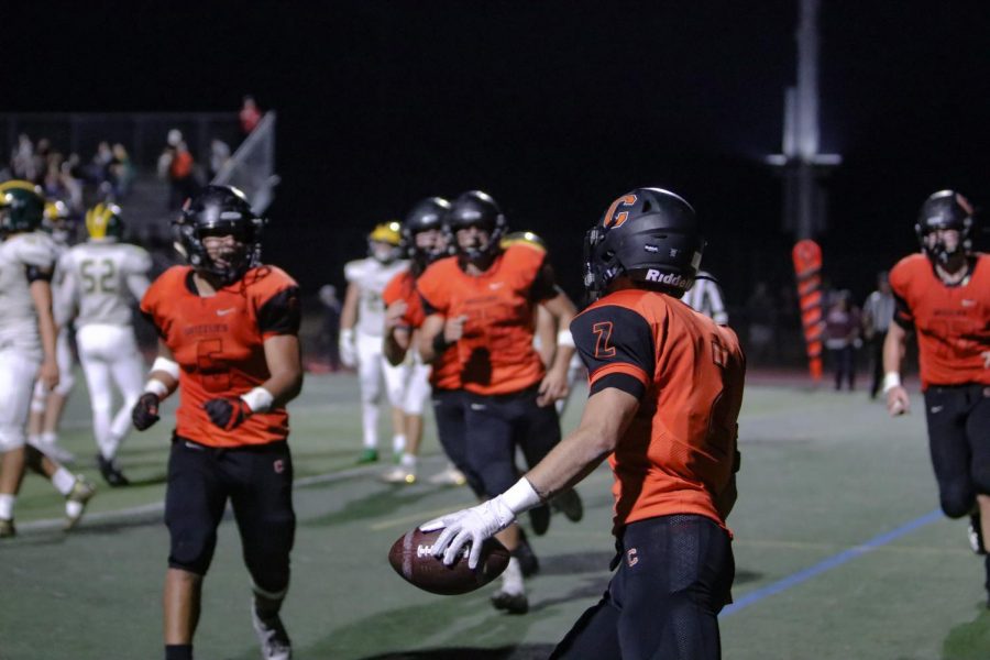 Above, senior Belal Alatasi, right, gets ready to celebrate a touchdown with his unrushing teammates. Unfortunately, the Grizzlies lost the homecoming game on October 25 to San Ramon Valley, 24-21, in the closing seconds of the game.