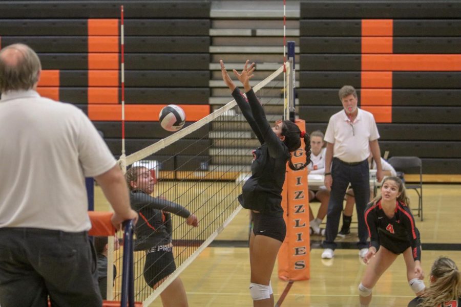 Senior Ellie Dutcher, left, gets her shot blocked by a James Logan player in Cals five-set loss in the NCS quarterfinals on Nov. 2. Despite holding a 2-1 lead, the No. 3 seeded Grizzlies couldnt hold on against No. 6 James Logan, losing the last two sets to fall 3-2.