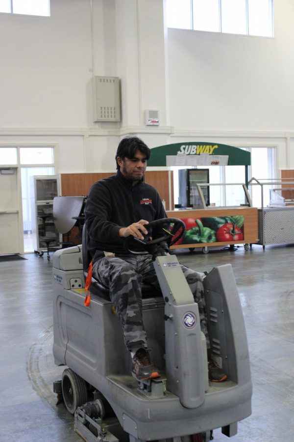 Head custodian Roberto Manrique buffs the commons floor. Manrique has been working at Cal High since 2007.