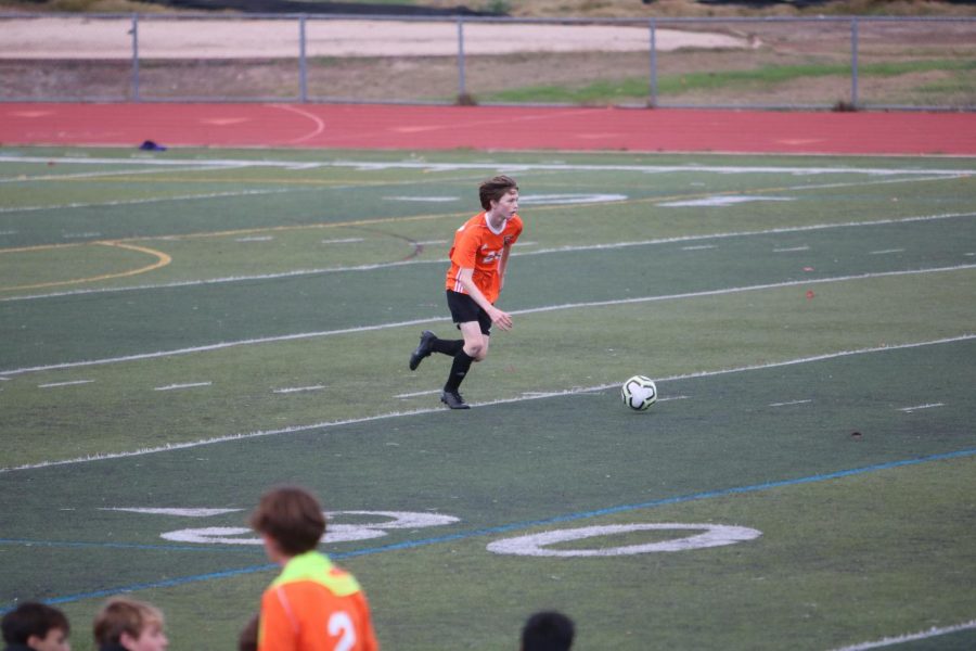 Sophomore Samuel Langfels dribbles the ball downfield in win over Moreau Catholic.