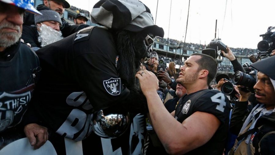 Raiders+quarterback+Derek+Carr+greets+avid+fans+as+the+Raiders+are+booed+off+the+field+in+their+last+game+in+Oakland.+Fittingly%2C+the+Raiders+lost+the+game+to+Jacksonville%2C+20-16.+Photo+Courtesy+of+The+Oklahoman.