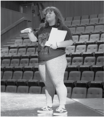 Senior Sarah O’Brien directs cast members in her choreography for “We Will Rock You: The Musical”, which would have been performed April 22-24 in the school theater.