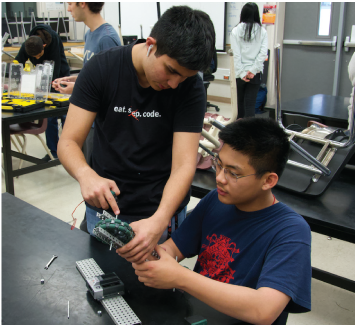 Sophomore Shaurya Srivastav, left, and freshman Andrew Chen, right, build a robot during one of the Grizzly Cub Program meetings.
