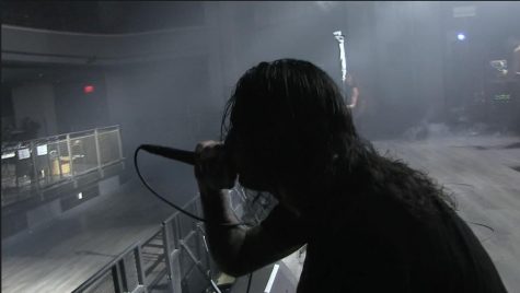 Code Orange performs for an empty auditorium–that space in front of the stage should be packed with fans.