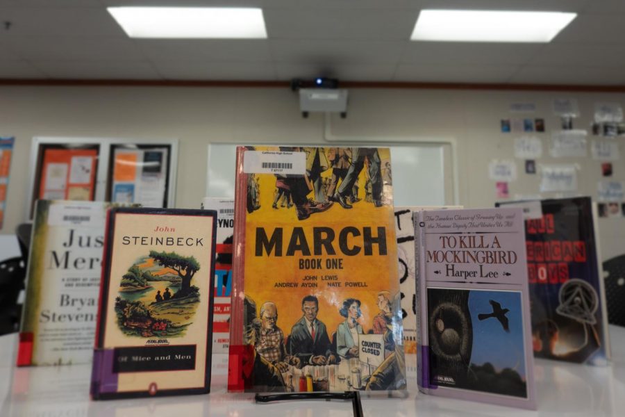 The classic novels “Of Mice and Men” and “To Kill a Mockingbird” - displayed here in Cal Highs library - have the attention of some students, who are pushing for the district to remove them from the freshmen required reading list because they include offensive racial slurs such as the N-word and are deemed by some to be too discriminating.