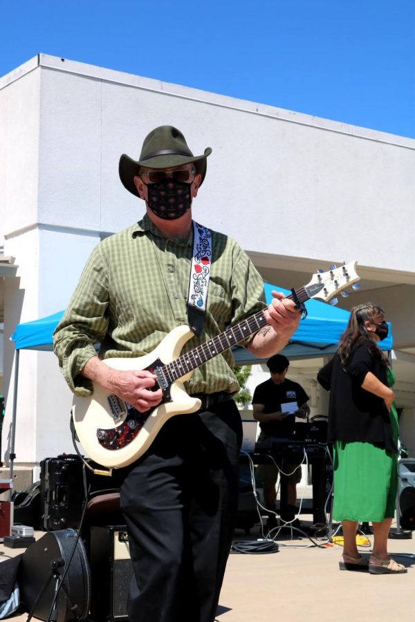 History teacher Scott Hodges plays the guitar with Partial Credit during his last performance in late May. Hodges is retiring after 23 years at Cal High.