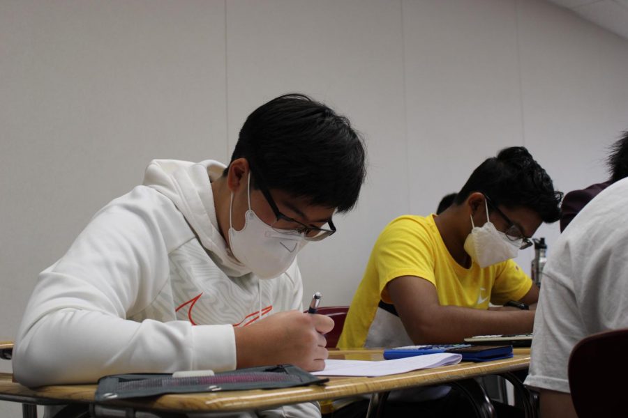 Sophomore Alexander Pak does work in his AP Calculus BC class. More underclassmen are taking AP classes this year.