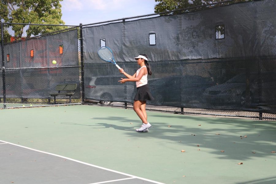 Freshman Gracie Barco returns a serve during a match against Dublin High. 