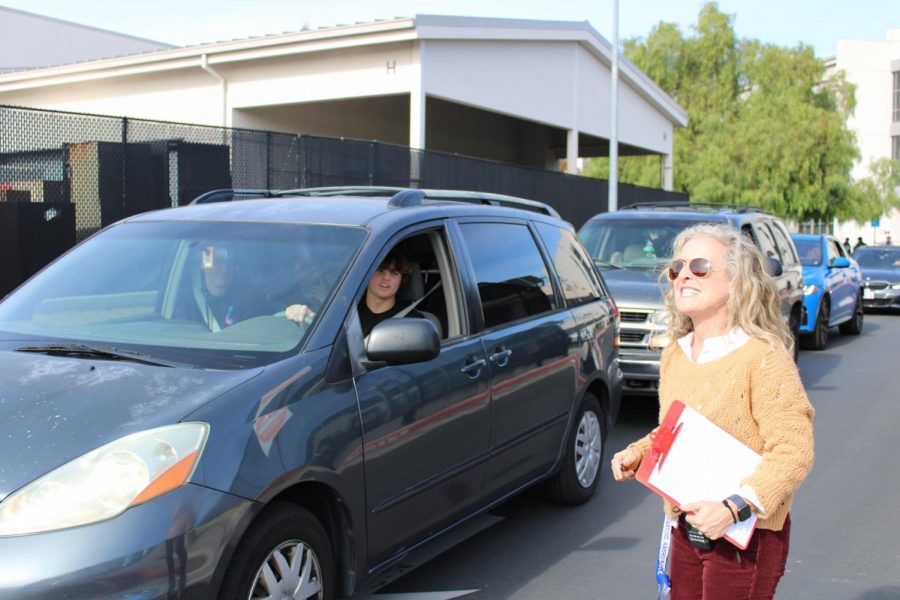 Principal Megan Keefer checks students as they leave campus at lunch. Only students who don’t have a fifth or sixth period scheduled are allowed to leave because of Cal High’s closed campus.