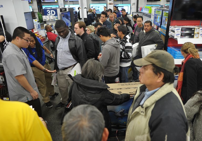 Rushing crowds line up in front of stores, scrambling in pre-Christmas spirit.