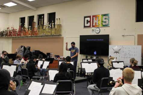 Band director Javier Cerna with his first period wind ensemble class in preparation for their Tuesday winter performance in the theater. This weeks band concerts are the first live performances since 2019.