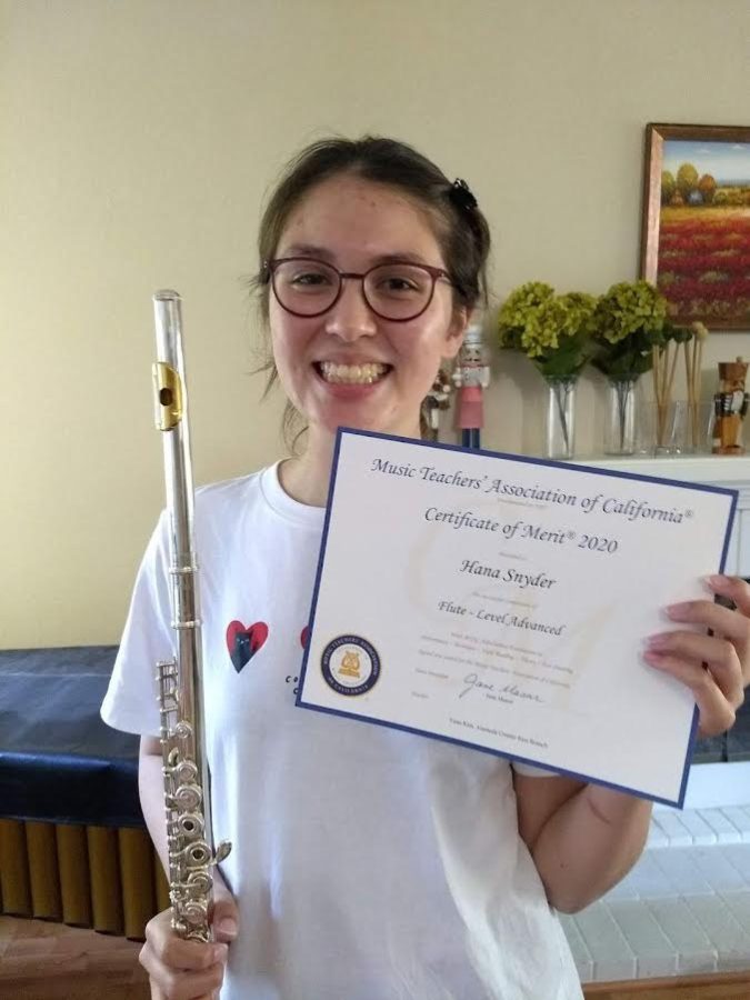 Senior Hana Snyder holds her certification for passing the Advanced Level in a previous CM exam.