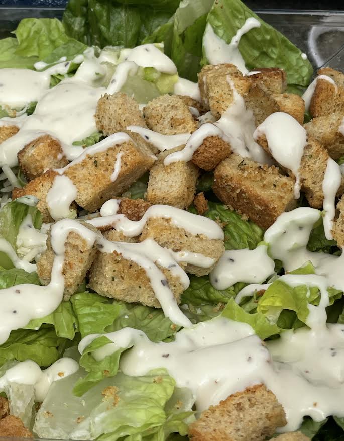 Caesar+dressing+and+croutons+decorate+one+of+Cal+Highs+vegetarian+salads.+Students+discovered+that+the+Caesar+salad+dressing+contains+anchovies.
