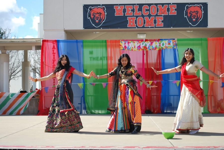 From left to right, Sami Tripasuri, Praneeta Agrawal and Pari Saluja perform a Bollywood fusion dance for Cal High staff and parents on Feb 22. as part of an on-campus Holi celebration.