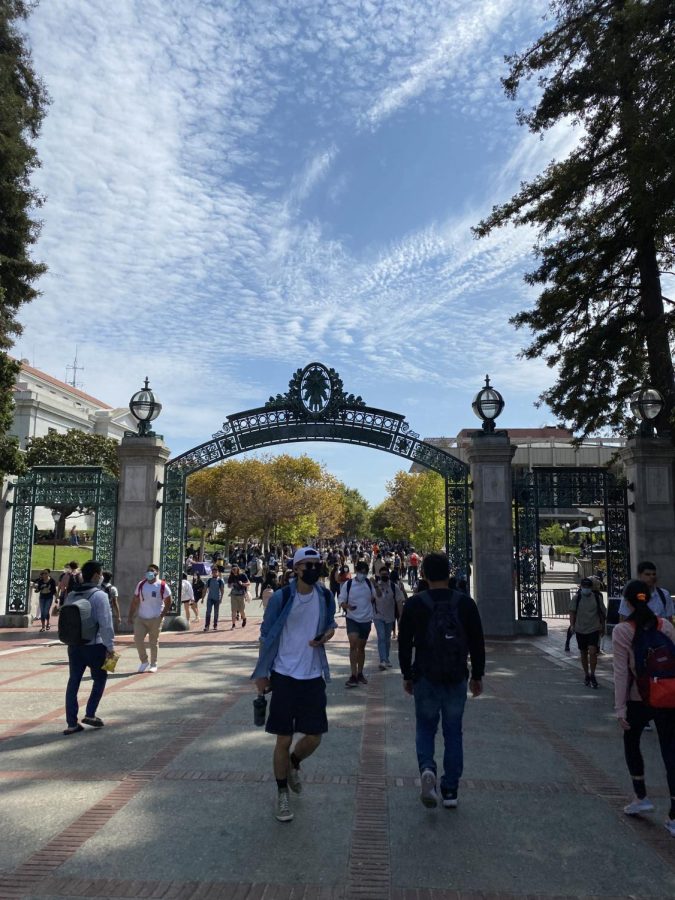 UC+Berkeley+students+walk+under+Sather+Gate+on+campus.+The+colleges+decision+to+cut+enrollment+was+overturned+by+Gov.+Gavin+Newsom.