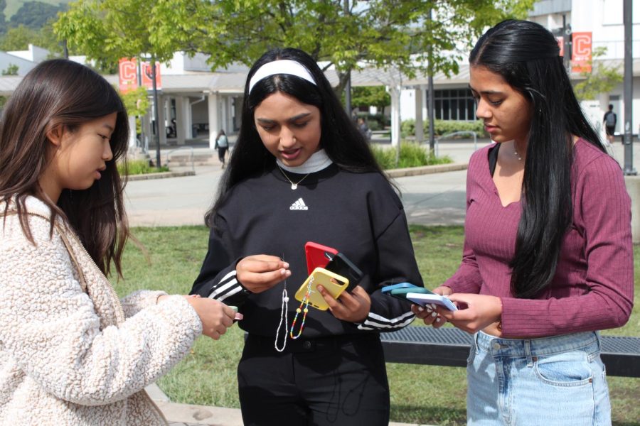 From left to right, Bori Kim, Shruti Kale and Aastha Agrawal show off their sustainable products for Eco-Case.