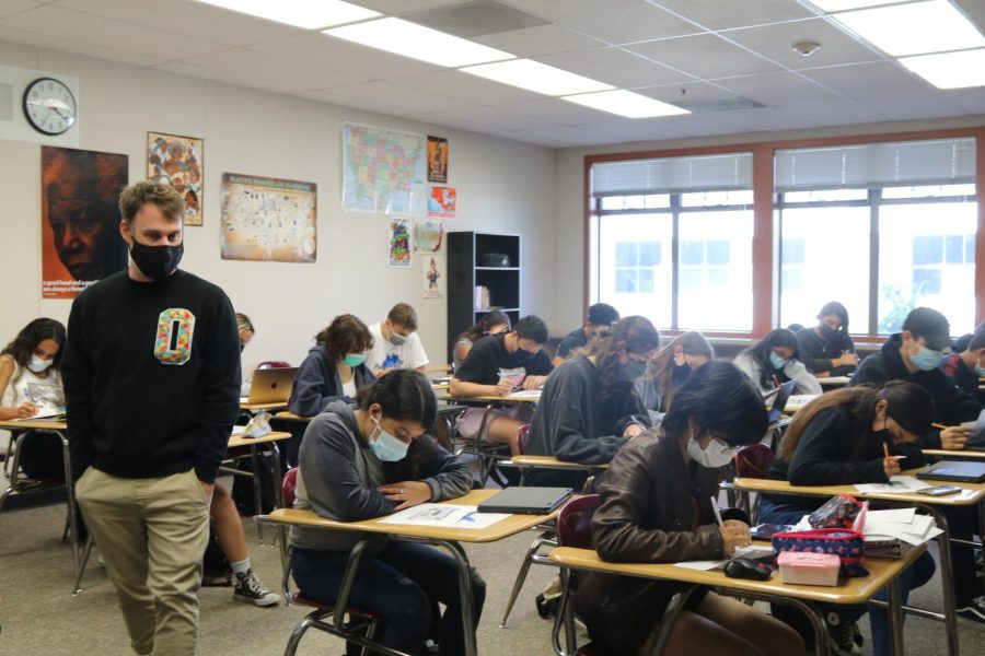 Ethnic studies teacher Ben Andersen supervises his students while they work during class. His students have been working on their Youth Participatory Action Research projects.